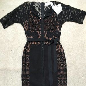 Beautiful black lace dress with tanish underneath.  Size 4